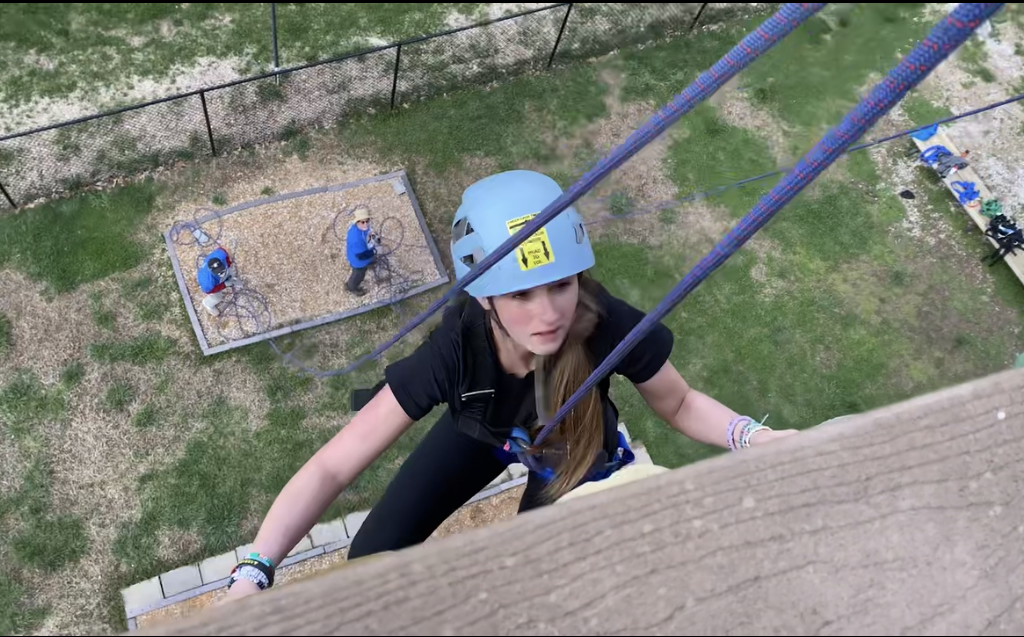 Girl Climbiing up Tower